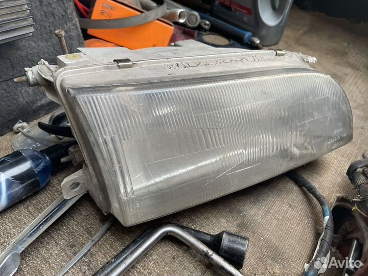 Фара передняя Toyota corolla ae100