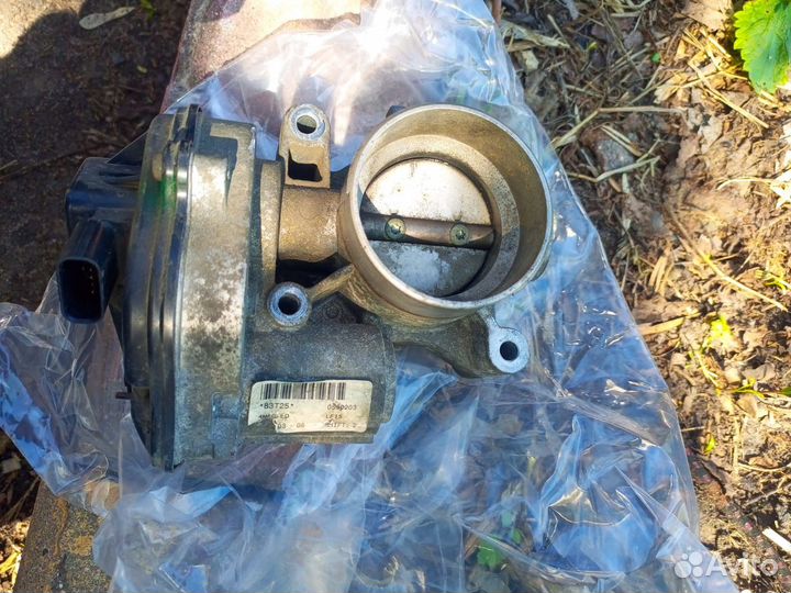 Троселная заслонка