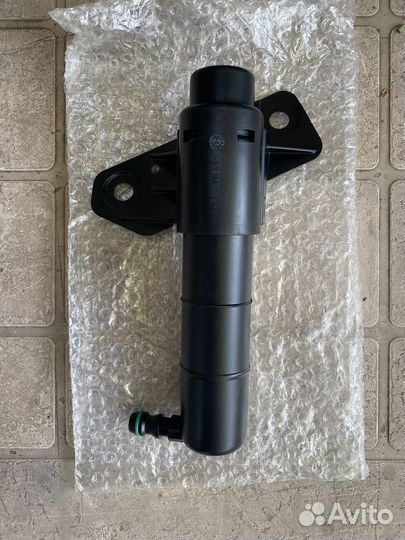 Форсунка омывателя фары Киа Спортаж3 (левая)