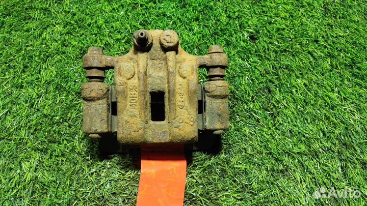 Суппорт тормозной задний левый KIA Sportage 3