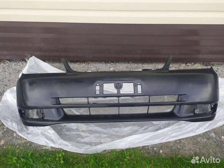 Бампер передний на toyota corolla NZE121 2000-2002