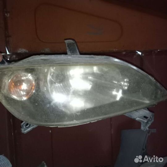Фара левая и правая на мазда демио DY