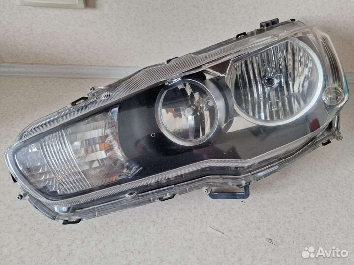 Фара передняя левая на mitsubishi lancer 10