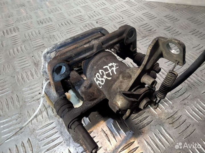 Суппорт задний правый Опель Астра J