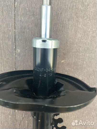 Амортизатор передний левый KIA Spectra (00-11)