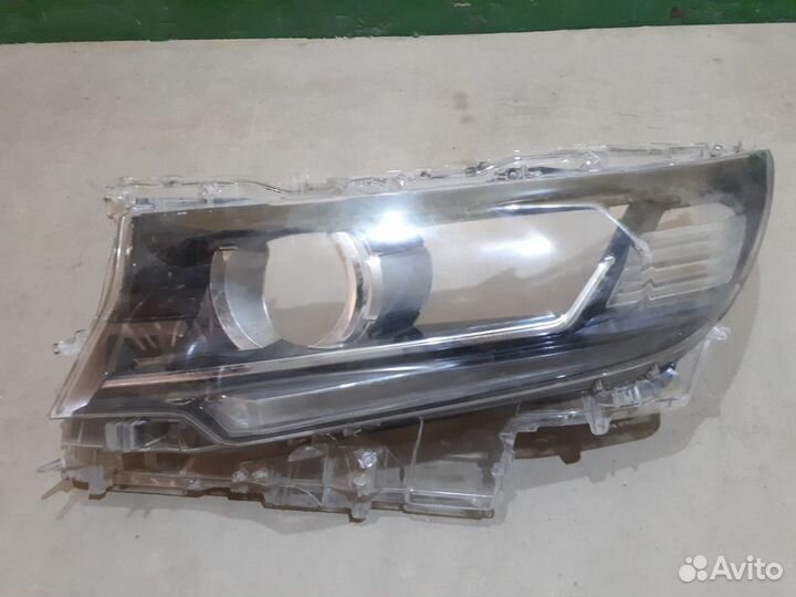 Стекло фары левой Toyota Land Cruiser Prado 150