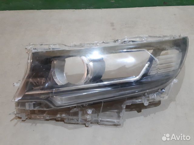 Стекло фары левой Toyota Land Cruiser Prado 150