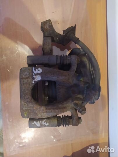 Суппорт задний левый Ниссан икс Трейл Т-32