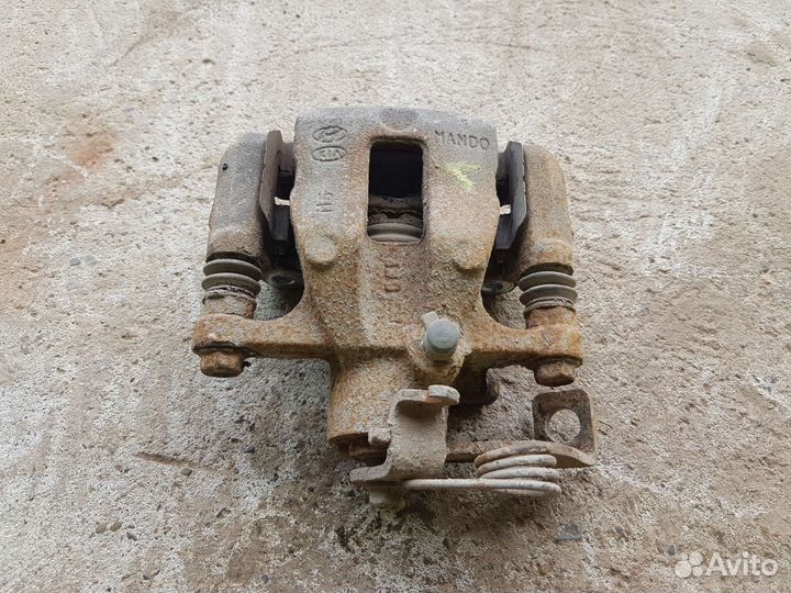 Суппорт задний левый kia rio 3