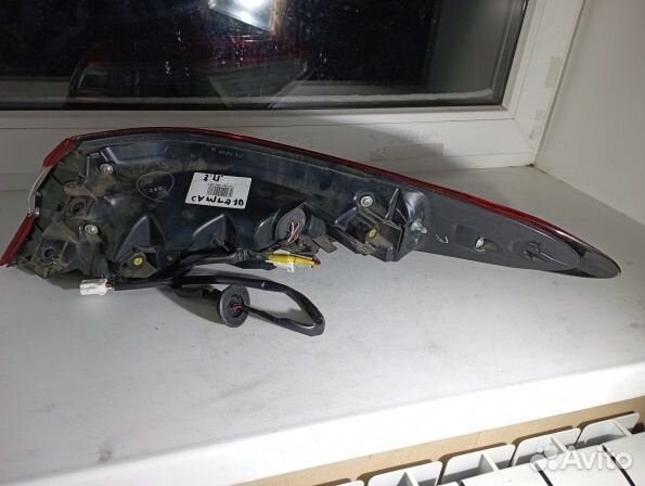 Тойота Камри 70 фонарь задний левый В крыло