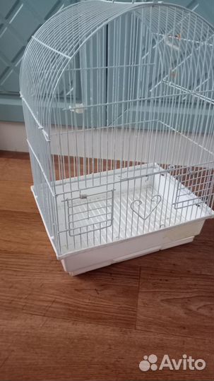 Клетка для попугая и корма для пернатых