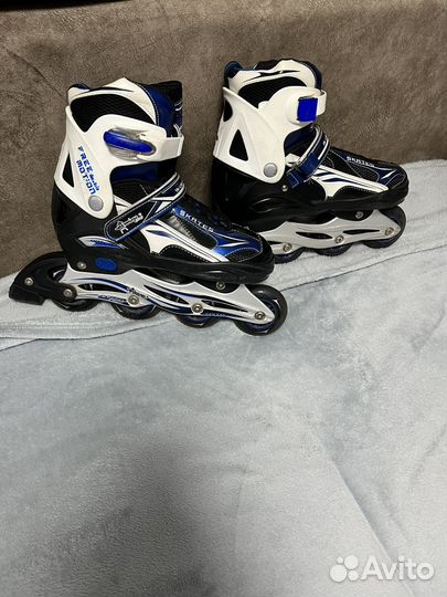 Роликовые коньки