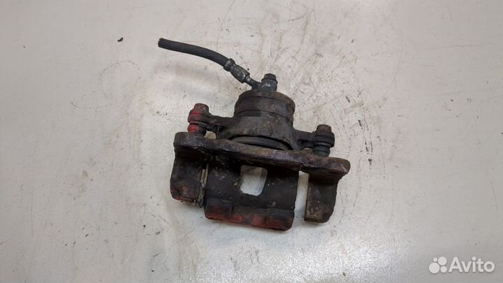 Суппорт левый передний Nissan 100NX