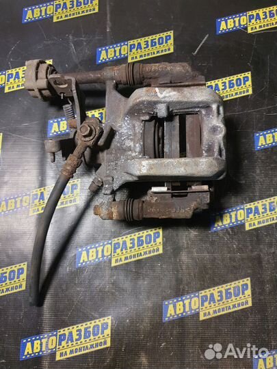 Суппорт тормозной задний левый Opel Astra J