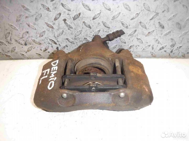 Суппорт тормозной передний левый Mazda Demio