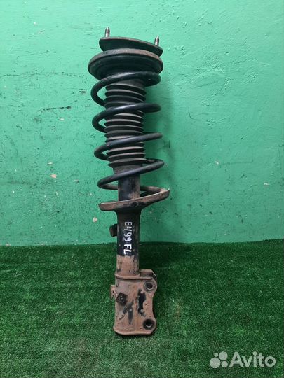 Стойка амортизатора передняя левая Suzuki Grand V