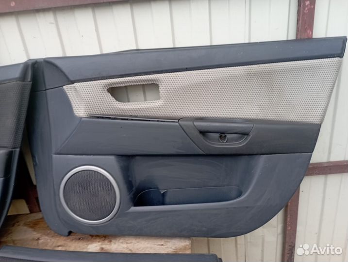 Обшивка двери Mazda 3 BK