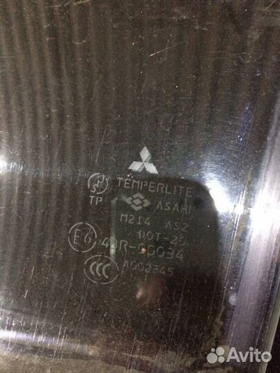 Стекло передней левой двери Mitsubishi Montero Sport