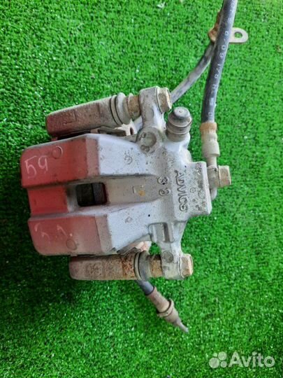 Суппорт тормозной задний левый Toyota Camry GSV40