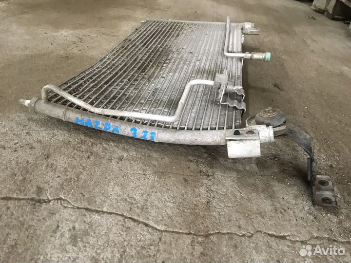 Радиатор кондиционера (конденсер) (Mazda 323)