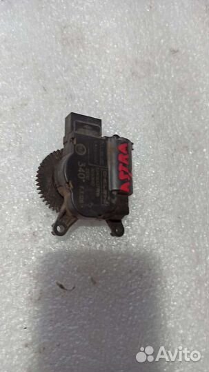 Моторчик заслонки отопителя Opel Astra h