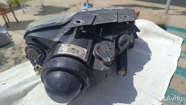 Фара Passat b6