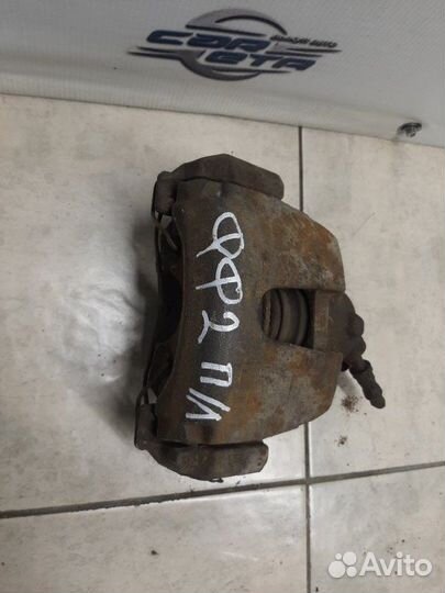 Суппорт тормозной передний левый Ford Focus седан