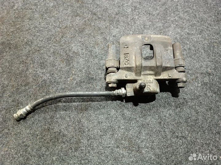 Суппорт тормозной задний правый Mitsubishi Lancer