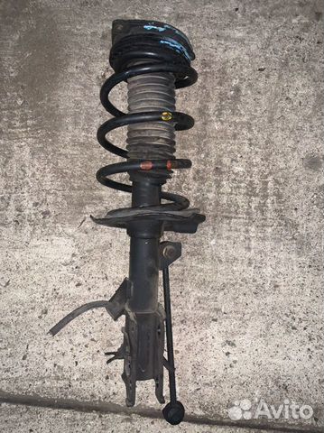 Стойка передняя левая Ниссан Сирена C25