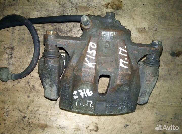 Суппорт передний правый Toyota Corolla E150