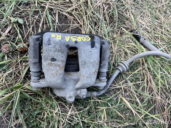 Тормозной суппорт передний Opel Corsa D