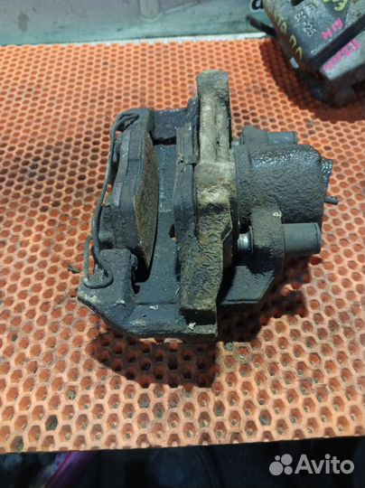 Суппорт тормозной передний левый Volkswagen Polo