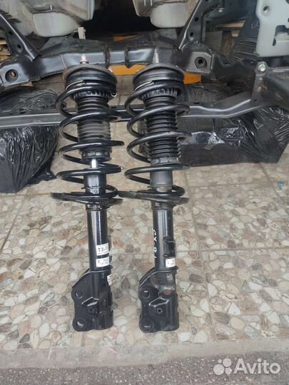 Стойка амортизатора Mazda сх 9 (2) 2018-2022г