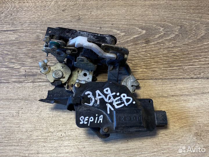 Kia sephia задний левый замок двери