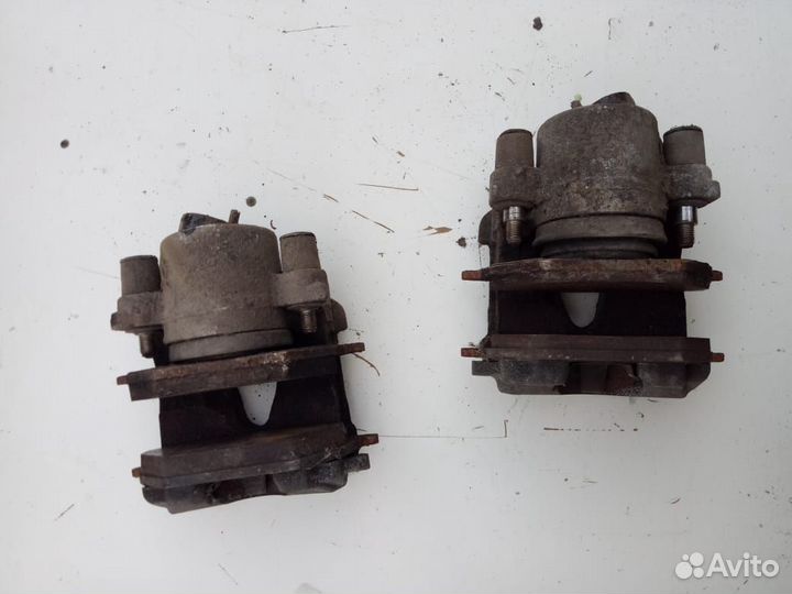 Суппорт тормозной передний Skoda Octavia 1.4