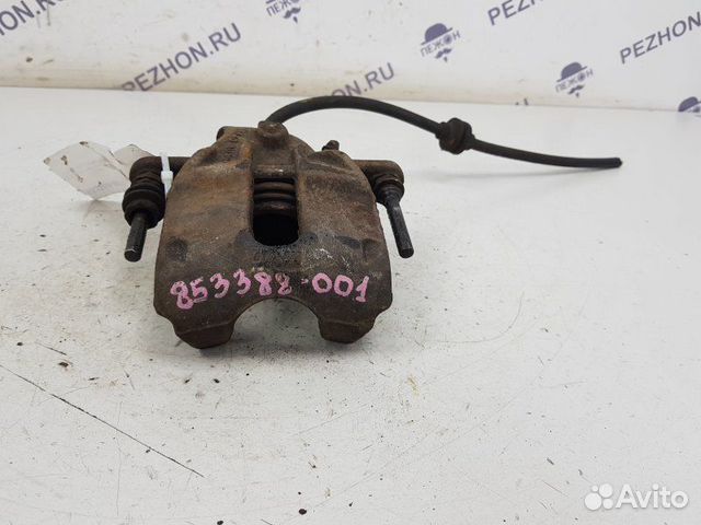 Суппорт тормозной передний левый Nissan Almera