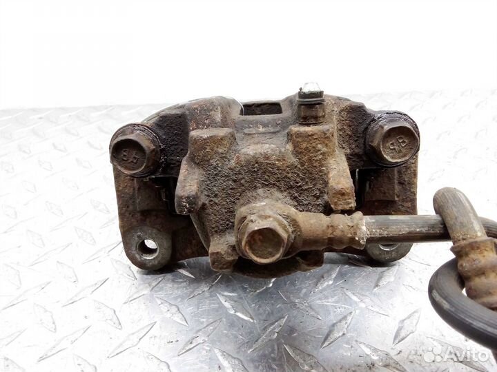 Суппорт задний левый Mitsubishi Pajero 4