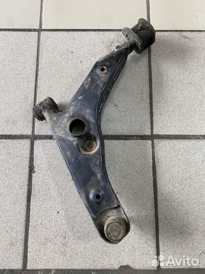 Передний рычаг Mitsubishi Lancer VII