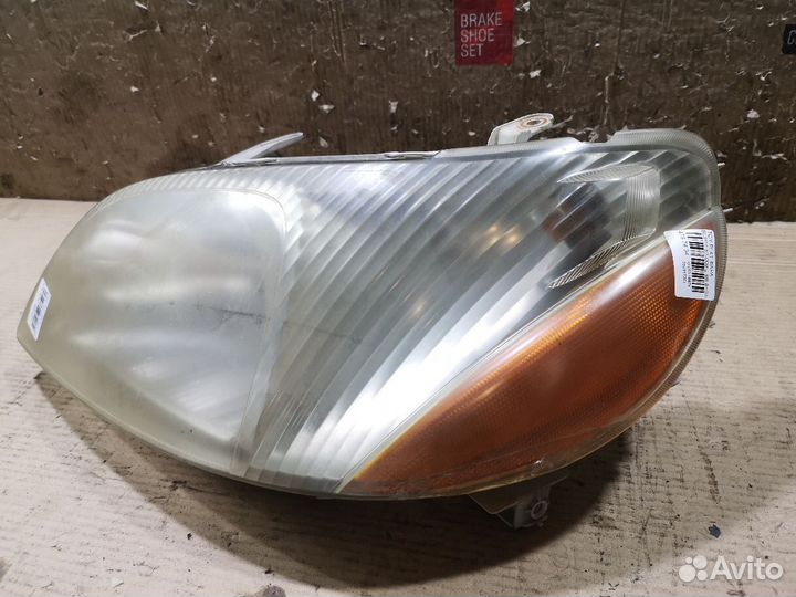 Фара левая Toyota Platz SCP11