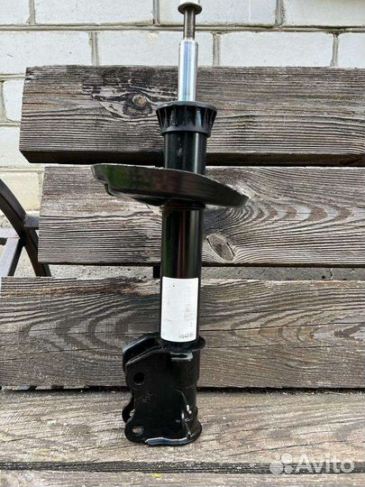 Амортизатор передний Опель Корса Д