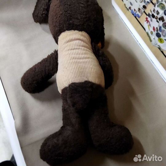 Плюшевая собака с резиновым лицом