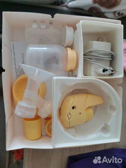Молокоотсос medela электрический