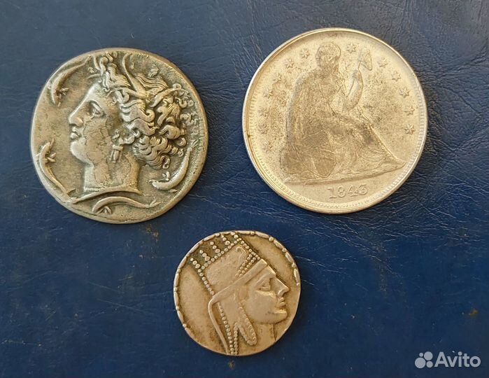 2 античные монеты и доллар