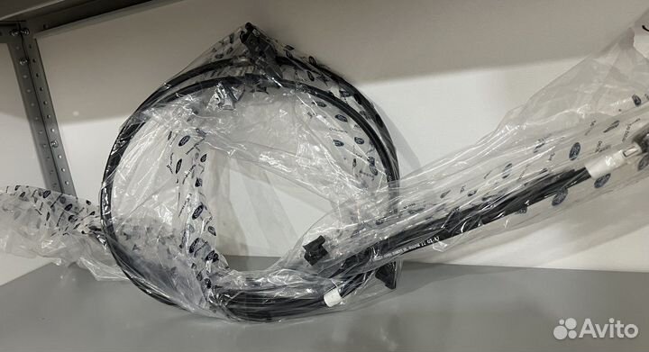 Тросс ручного тормоза на Ford Focus