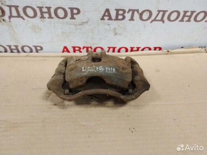 Суппорт тормозной передний левый Toyota Yaris