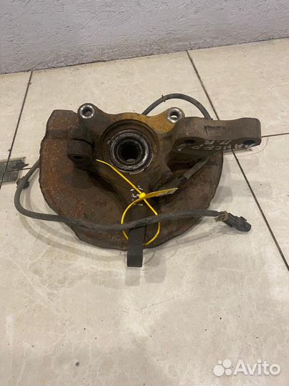 Поворотный кулак передний правый Mitsubishi Lancer