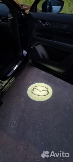 Mazda CX5 KF Подсветка в двери проекция C850V7540A