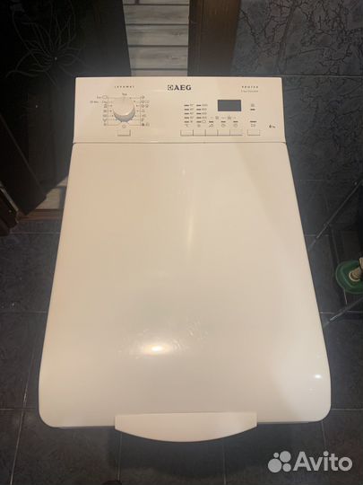 Стиральная машина с вертикальной загрузкой AEG