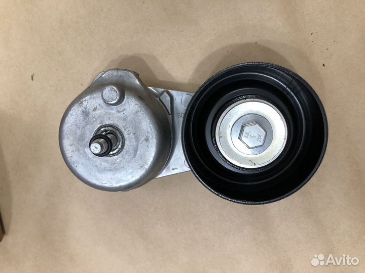 Натяжитель приводного ремня Mazda AJ0315980B