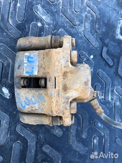 Тормозной суппорт передний левый Renault Logan